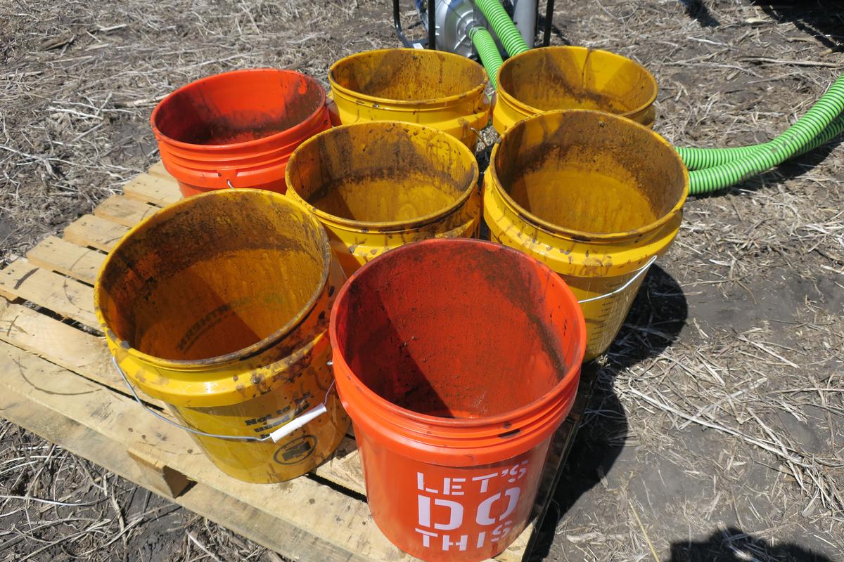 Empty buckets of manure.